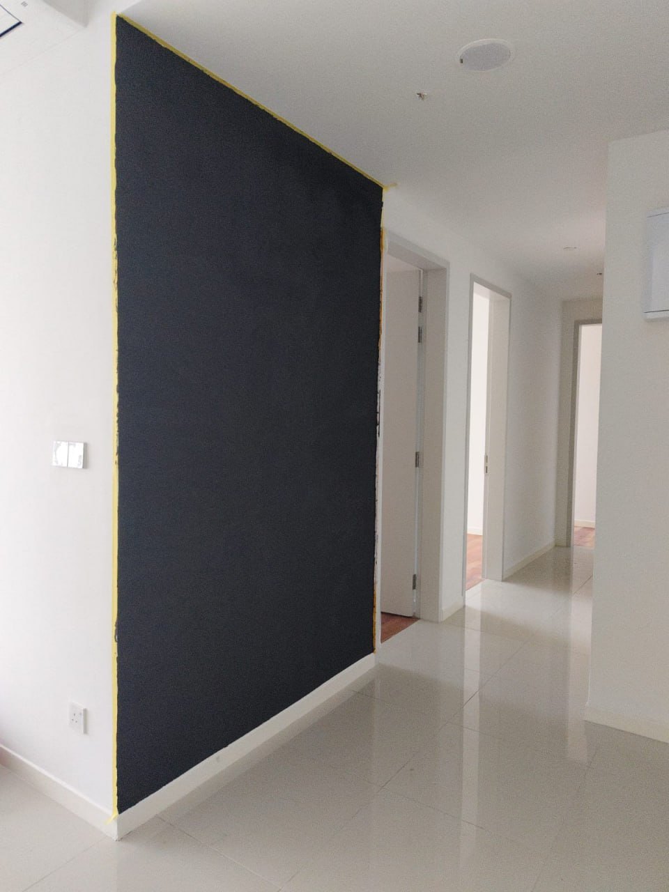 Dark magnetic plaster layer on a home wall before painting