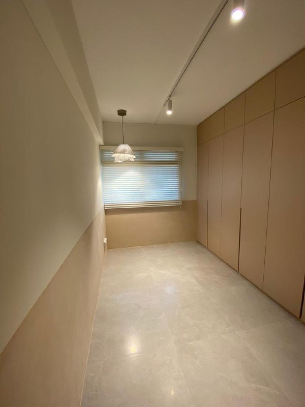 Two-tone limewash wall above built-in cabinets