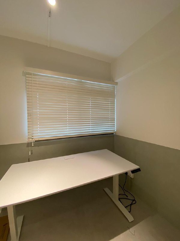 Two-tone limewash wall in a home study