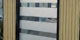 Smart film with custom etched privacy bands on glass