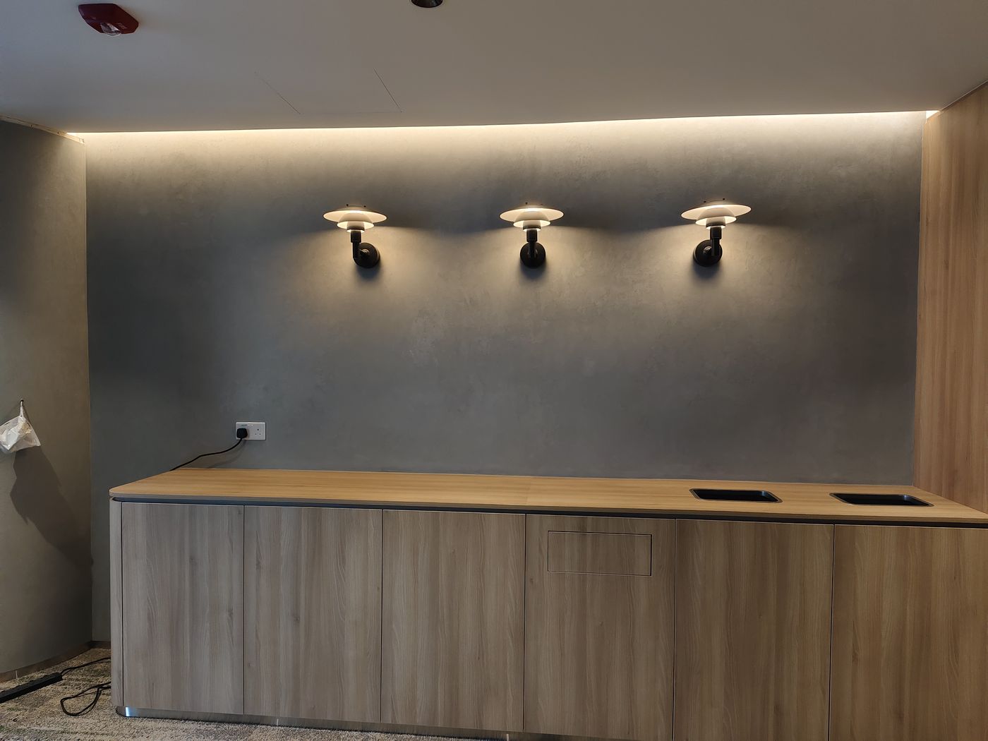 Suzuka Satin premium wall finish on a feature wall with spotlights