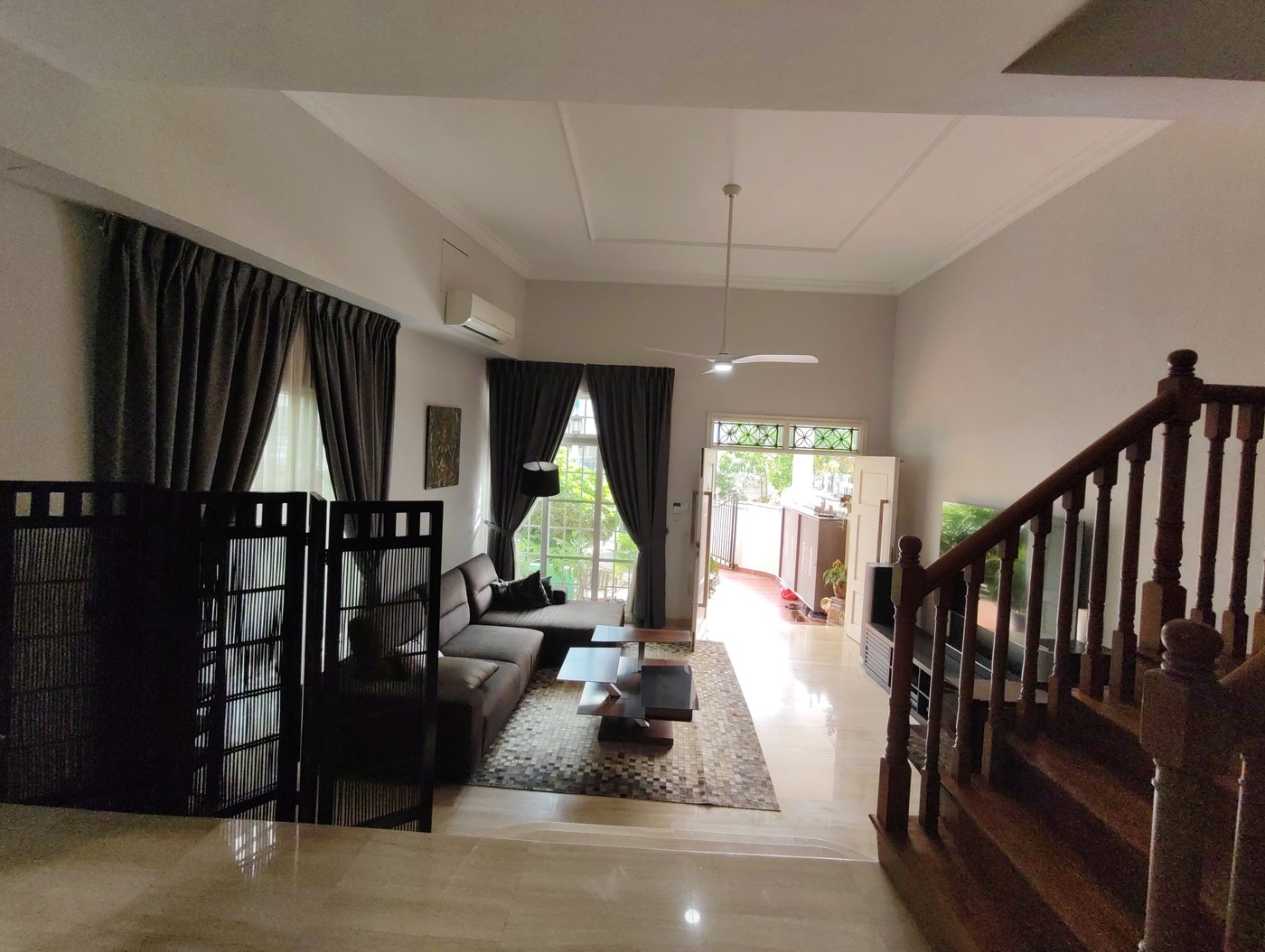 Freshly repainted living room and staircase hall in a landed home
