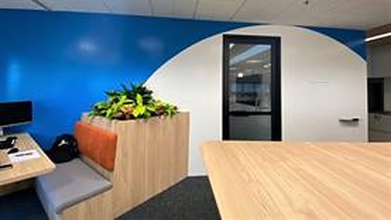 Common space with a curved ZETA whiteboard paint wall, DLL at The Concourse