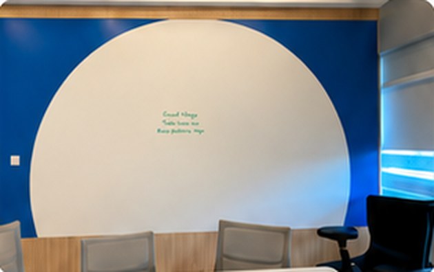 Round writable feature in ZETA Whiteboard Paint on a blue wall