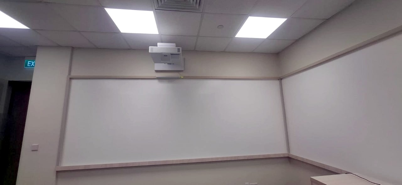 Semi-matte whiteboard film walls in a training room, Ministry of Manpower office